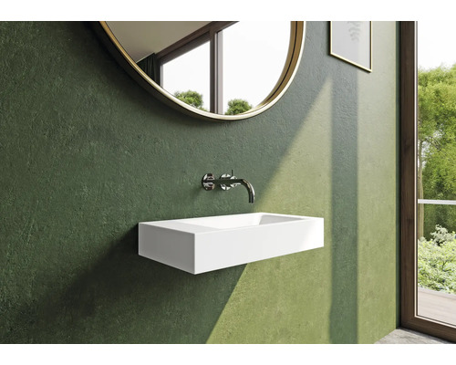 Salle de bain moderne avec vasque à poser, robinetterie et miroir rond