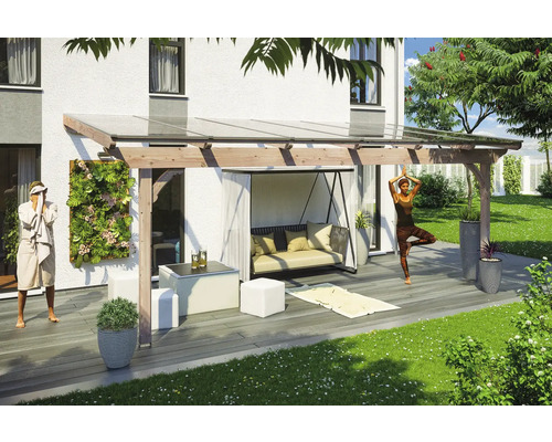 Terrasse avec toit, balançoire et décoration dans le jardin