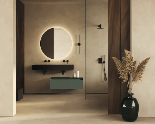Salle de bains moderne avec miroir rond, lavabo et douche