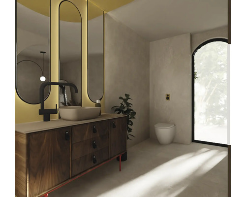 Badezimmer mit Waschtisch, Spiegel und Toilette für eine helle und freundliche Atmosphäre