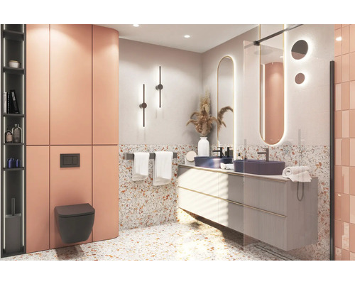 Modernes Badezimmer mit Waschtisch, Spiegel, Toilette und Fliesen in Terrazzo Optik.