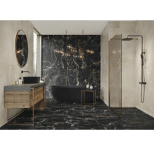 Salle de bain moderne avec sol en marbre noir, baignoire, lavabo et douche.