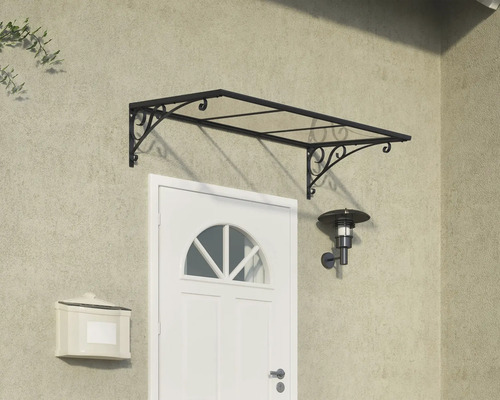 Auvent de porte d''entrée avec support filigrane au-dessus d''une porte d''entrée blanche