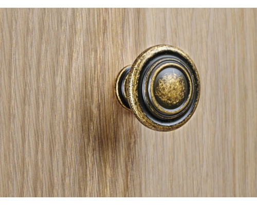 Bouton de meuble rond sur une surface en bois