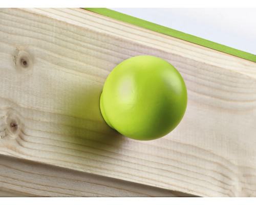 Ein runder, grüner Türknauf an einem Holzbrett