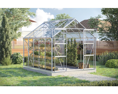 Gewächshaus aus Glas und Aluminium mit Pflanzen im Garten
