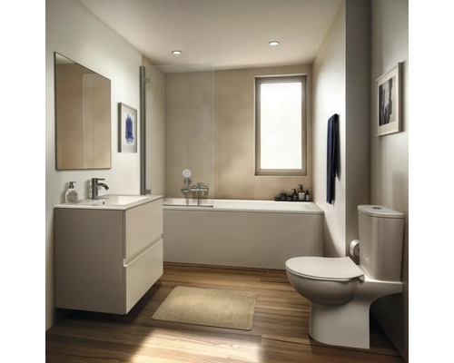 Salle de bain avec baignoire, meuble sous-lavabo et toilettes