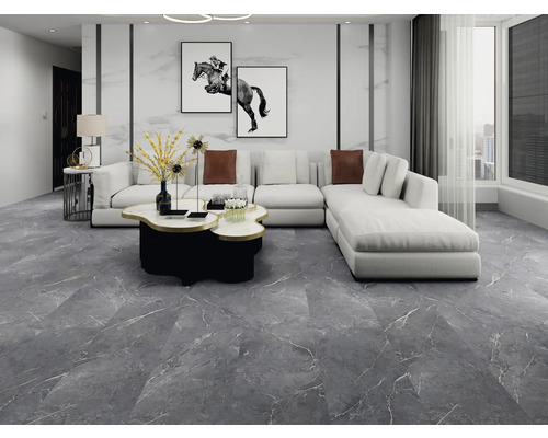 Salon avec carrelage de sol gris aspect marbre, canapé blanc et table basse moderne