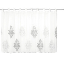 Brise-bise blanc avec motif ornemental argenté et pattes.