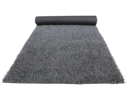 Gazon synthétique gris partiellement enroulé