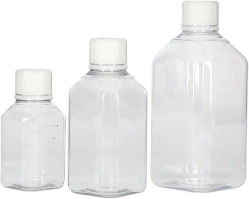 Trois bouteilles en plastique transparent avec bouchon blanc de différentes tailles.