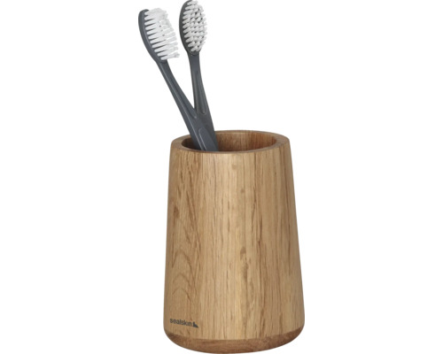 Zahnbürsten in einem Zahnputzbecher aus Holz