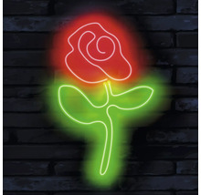 Rose néon sur un mur de briques