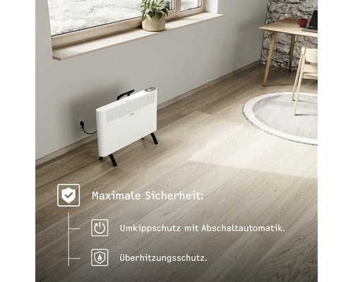 Radiateur convecteur blanc avec protection contre la surchauffe et protection anti-basculement dans le salon.