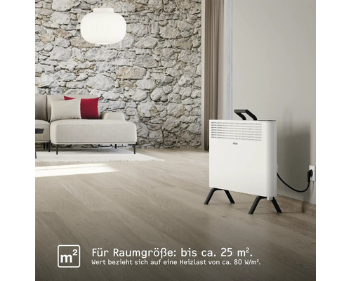 Salon avec canapé et chauffage électrique sur pieds