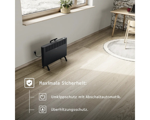 Schwarzer Konvektorheizkörper mit Überhitzungsschutz und Kippschutz mit Abschaltautomatik im Raum