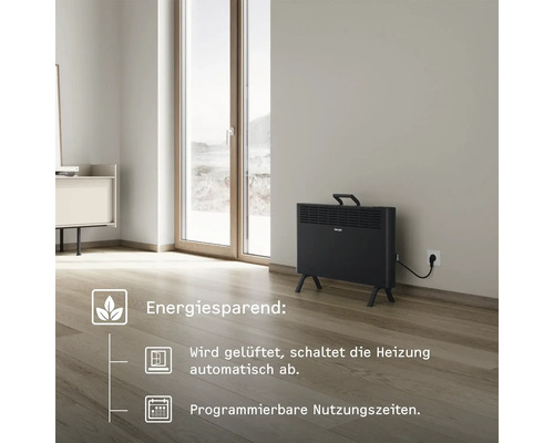 Elektrischer Heizkörper im Raum mit Energiesparfunktion, Abschaltautomatik beim Lüften und programmierbaren Nutzungszeiten.