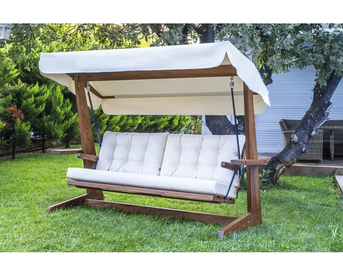 Balancelle de jardin en bois avec coussins et toit solaire dans le jardin