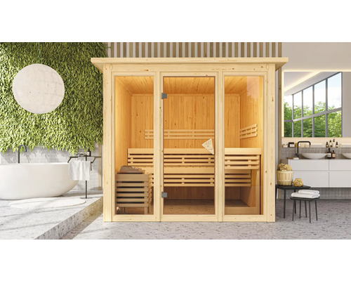 Holzsauna mit Glastür in einem hellen Badezimmer mit Badewanne und Waschtisch