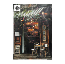 Toile décorative représentant un bar de style vintage avec des tables et des chaises à l''extérieur