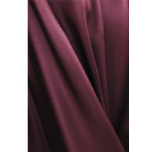 Gros plan d''un tissu bordeaux avec des plis.