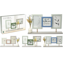 Set de cadres photo décoratifs avec trois cadres, vase et fleurs séchées sur une étagère