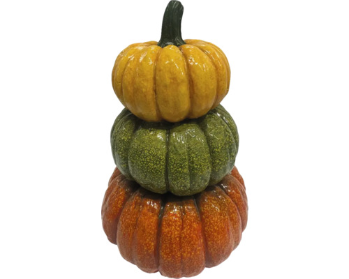 Citrouilles décoratives empilées en jaune, vert et orange.
