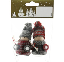 Geroma Logo. Deux poupées de Noël tricotées dans un emballage.