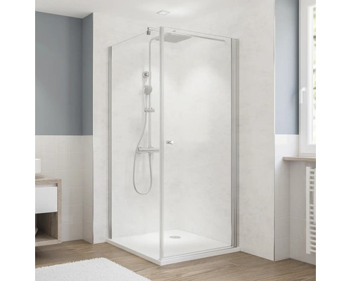 Cabine de douche avec pomme de douche et douchette dans la salle de bain