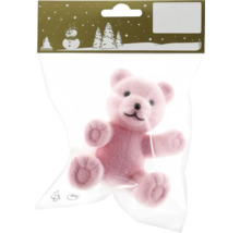 Ours en peluche rose comme article de décoration dans un emballage plastique
