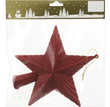 Étoile rouge comme décoration de sapin de Noël dans son emballage