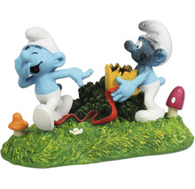 Dekoration für Aquarien mit zwei Schlümpfen auf einer grünen Grasfläche mit Pilzen und einer gelben Burg.