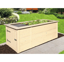 Jardinière surélevée en bois avec herbes et couverture dans le jardin