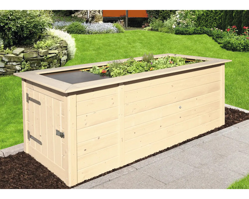 Jardinière surélevée en bois avec herbes et couverture dans le jardin