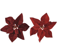 Deux poinsettias artificiels rouges avec des feuilles