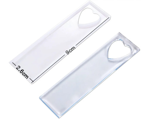 Deux moules de marque-page transparents en silicone en forme de cœur et mesurant 9 cm de long et 2,6 cm de large.