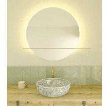 Aménagement de salle de bains avec miroir rond, meuble-lavabo et vasque à poser à motifs floraux