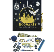 Calendrier de l''Avent Harry Potter avec divers accessoires sur le thème de Poudlard sous la neige