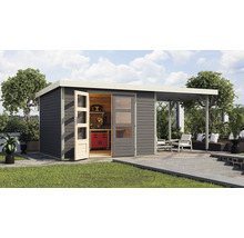 Abri de jardin avec établi et coin salon sur la terrasse