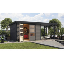 Abri de jardin moderne avec établi et terrasse couverte dans le jardin.