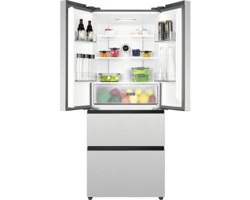 Réfrigérateur ouvert avec des aliments dans les compartiments et les tiroirs