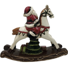 Weihnachtsdekoration: Santa Claus auf einem Schaukelpferd mit Weihnachtsbaum und Geschenken.