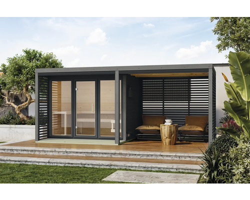 Scène de jardin avec sauna et coin salon sur une terrasse en bois
