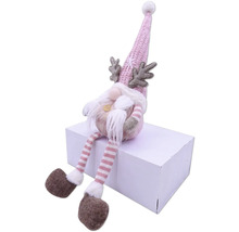 Figurine décorative de gnome avec bonnet, barbe et bois sur un paquet