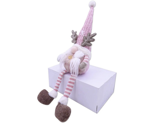 Figurine décorative de gnome avec bonnet, barbe et bois sur un paquet