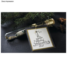 Tube en verre décoratif avec argent, étoiles et carte de vœux de Noël