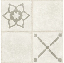 Carreau décoratif avec motif floral et design géométrique