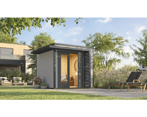 Jardin avec abri de jardin moderne, terrasse et mobilier de jardin.