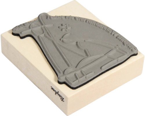 Stempel mit Pferdemotiv auf Holzblock