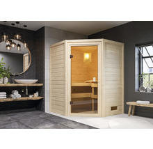 Sauna lumineuse avec porte en verre dans une salle de bain avec lavabo et miroir